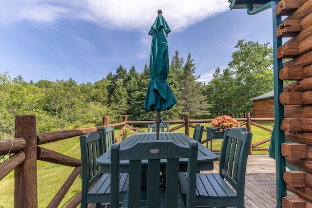 15 Tranquility Way, Ellsworth, ME 04605 - wooden terrace with outdoor dining area and a yard