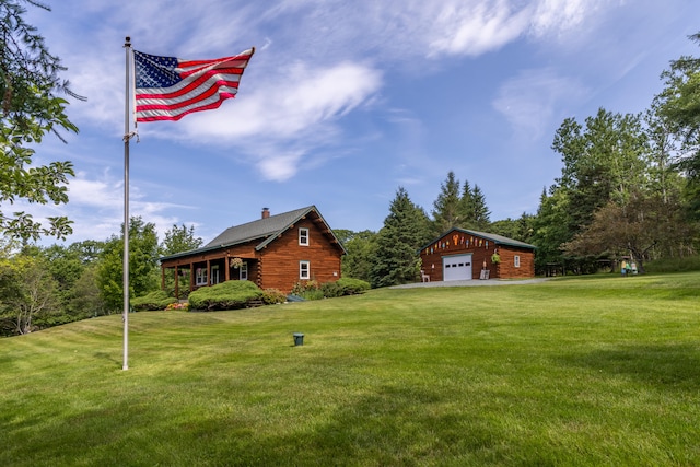 15 Tranquility Way, Ellsworth, ME 04605 - view of green lawn with a garage and an outbuilding