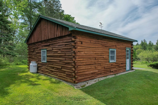 15 Tranquility Way, Ellsworth, ME 04605 - view of side of property featuring log siding and a yard
