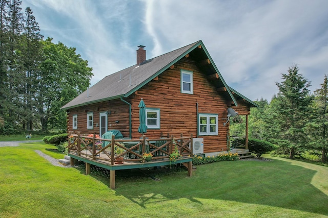 15 Tranquility Way, Ellsworth, ME 04605 - back of house with a chimney, log siding, a yard, and a deck