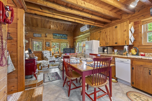 15 Tranquility Way, Ellsworth, ME 04605 - dining space with wood ceiling, wood walls, a wall mounted AC, light tile patterned floors, and a wood stove