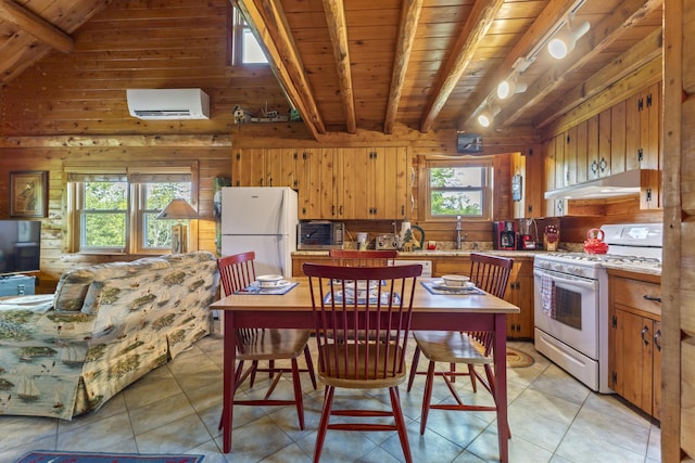 15 Tranquility Way, Ellsworth, ME 04605 - kitchen featuring white appliances, an AC wall unit, wood walls, a wood ceiling with exposed beams, and under cabinet range hood