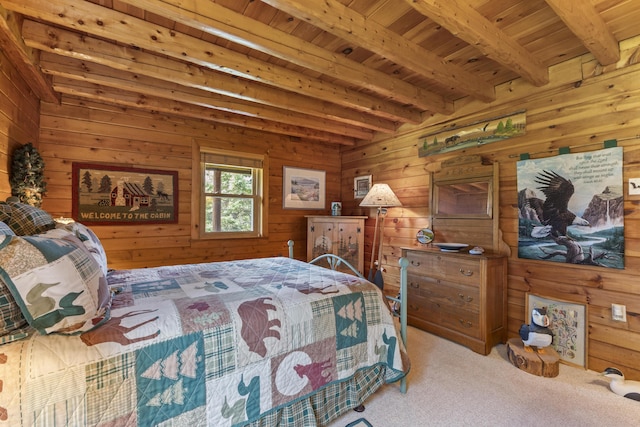 15 Tranquility Way, Ellsworth, ME 04605 - carpeted bedroom with wooden walls and a wood ceiling with exposed beams
