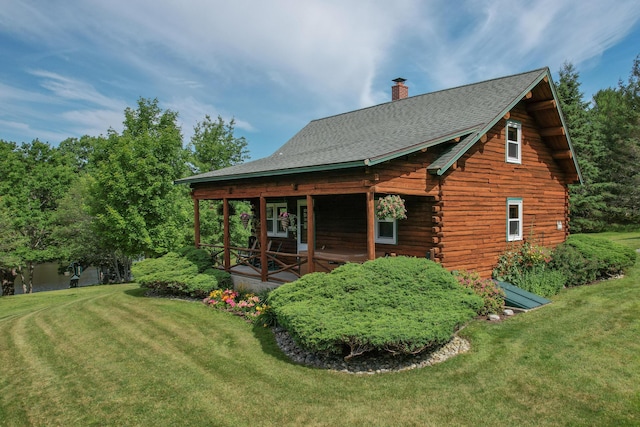 15 Tranquility Way, Ellsworth, ME 04605 - back of property featuring a chimney, a lawn, log exterior, and roof with shingles