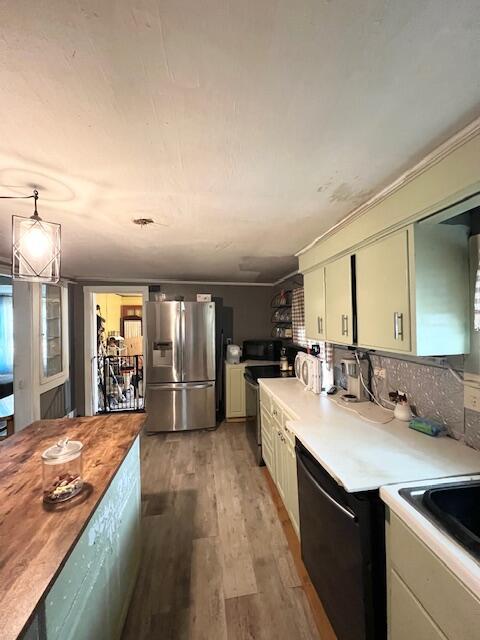 20 Coles Corner Rd, Winterport, ME 04496 - kitchen featuring stainless steel refrigerator with ice dispenser, range, light wood-type flooring, black microwave, and butcher block counters