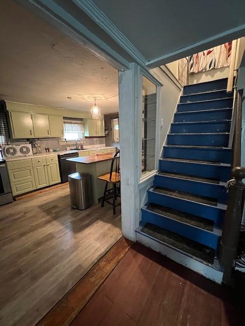 20 Coles Corner Rd, Winterport, ME 04496 - stairway featuring wood finished floors and ornamental molding