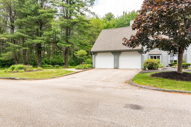 7 Wonderbrook Dr Unit 7, Kennebunk, ME 04043 - view of front of house with driveway, an attached garage, and a shingled roof