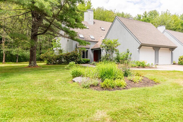 7 Wonderbrook Dr Unit 7, Kennebunk, ME 04043 - view of front of house with a chimney, an attached garage, and a front lawn