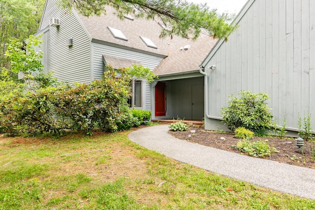 7 Wonderbrook Dr Unit 7, Kennebunk, ME 04043 - exterior space featuring a shingled roof and a lawn