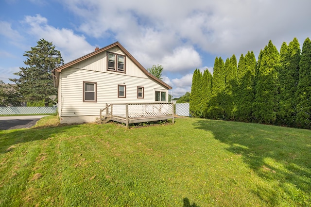2 Tucker St, Lewiston, ME 04240 - rear view of property featuring a lawn and a wooden deck
