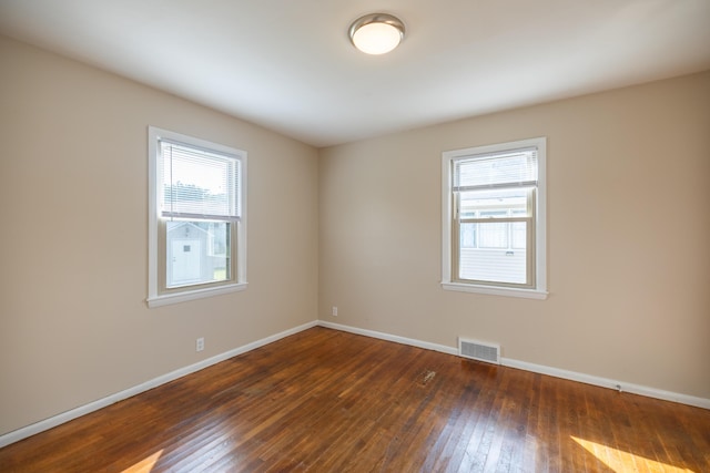 2 Tucker St, Lewiston, ME 04240 - spare room featuring healthy amount of natural light and dark wood finished floors