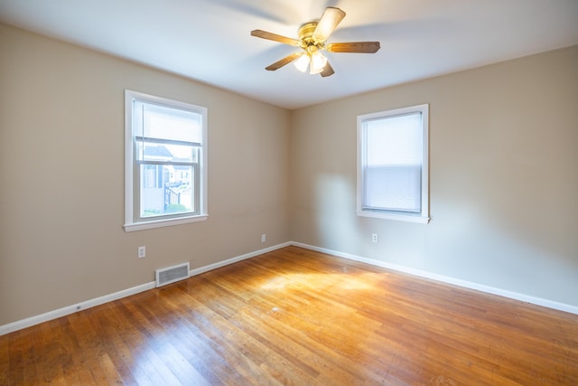 2 Tucker St, Lewiston, ME 04240 - unfurnished room featuring light wood-style floors and a ceiling fan