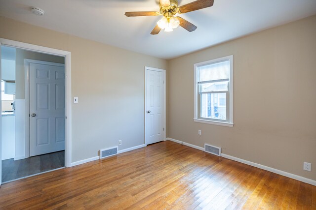 2 Tucker St, Lewiston, ME 04240 - empty room featuring a ceiling fan, light wood-type flooring, and a smoke detector