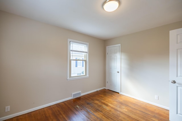 2 Tucker St, Lewiston, ME 04240 - unfurnished room featuring baseboards and wood finished floors