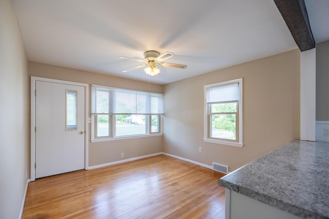 2 Tucker St, Lewiston, ME 04240 - entrance foyer featuring healthy amount of natural light, ceiling fan, and light wood finished floors