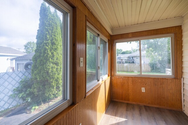 2 Tucker St, Lewiston, ME 04240 - unfurnished sunroom with wood walls and wood finished floors