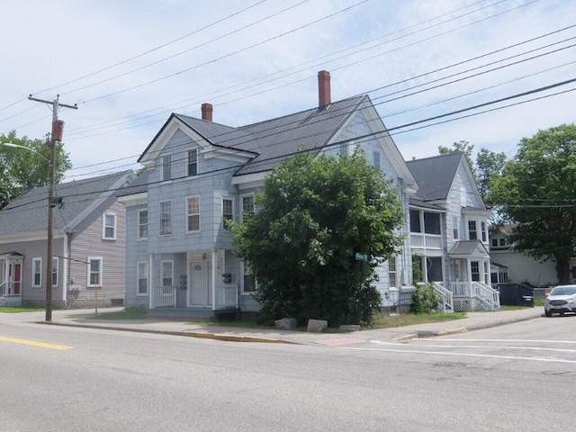 175 Alfred St, Biddeford, ME 04005 - view of property featuring a chimney