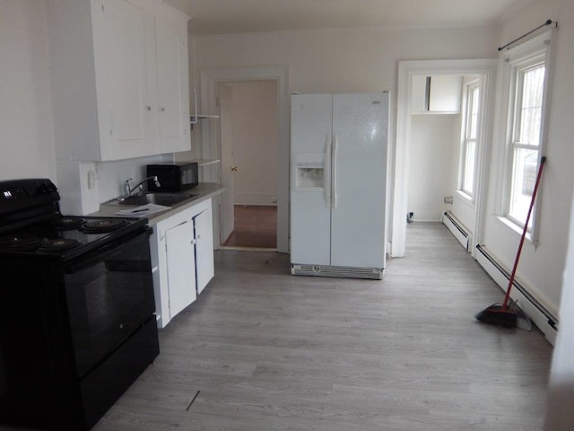 175 Alfred St, Biddeford, ME 04005 - kitchen featuring black appliances, white cabinets, and light wood-type flooring