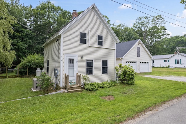 23 Cottage Dr, Friendship, ME 04547 - view of front facade with a chimney, driveway, and a garage