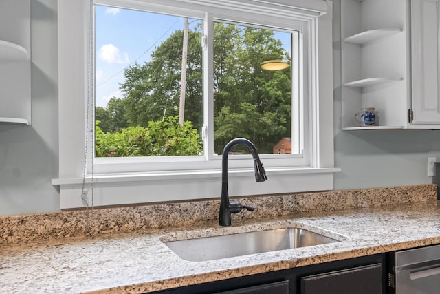 23 Cottage Dr, Friendship, ME 04547 - kitchen featuring open shelves, stainless steel dishwasher, white cabinets, and light stone countertops