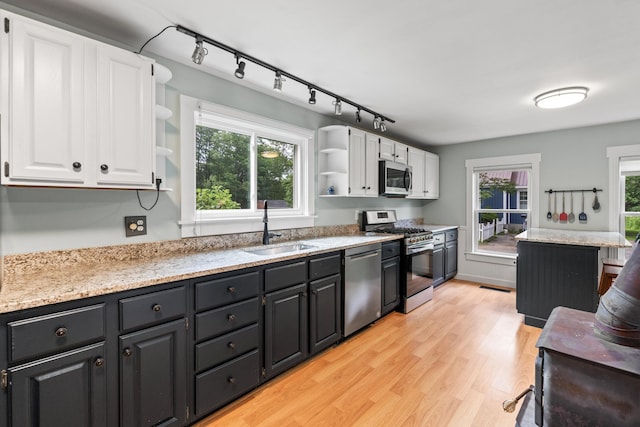 23 Cottage Dr, Friendship, ME 04547 - kitchen featuring open shelves, appliances with stainless steel finishes, white cabinetry, light wood finished floors, and track lighting