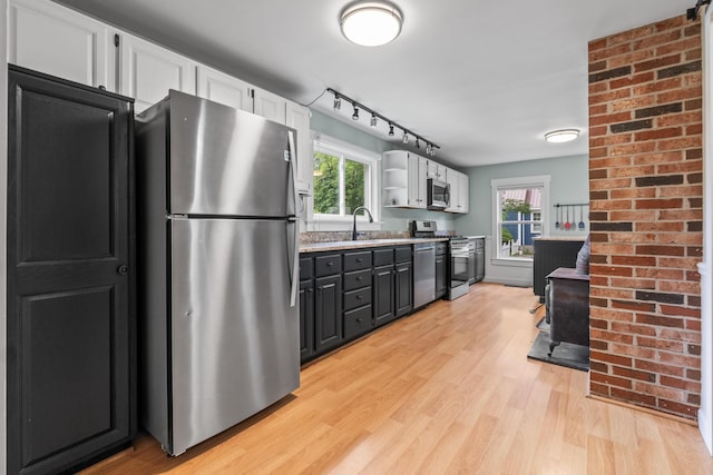 23 Cottage Dr, Friendship, ME 04547 - kitchen featuring stainless steel appliances, white cabinets, light wood-style flooring, and plenty of natural light