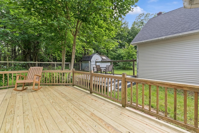 23 Cottage Dr, Friendship, ME 04547 - wooden deck featuring a shed and view of scattered trees