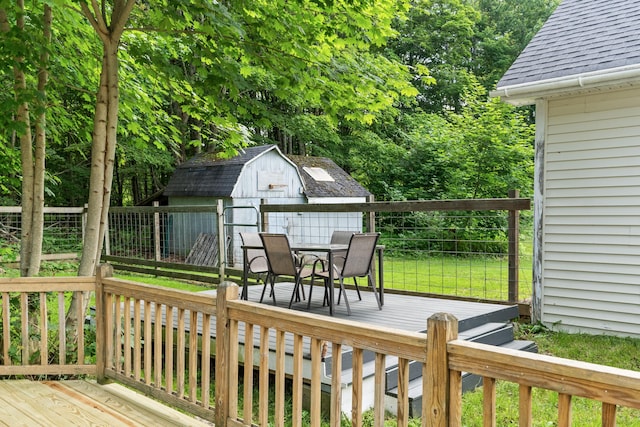 23 Cottage Dr, Friendship, ME 04547 - wooden terrace featuring outdoor dining space and a shed