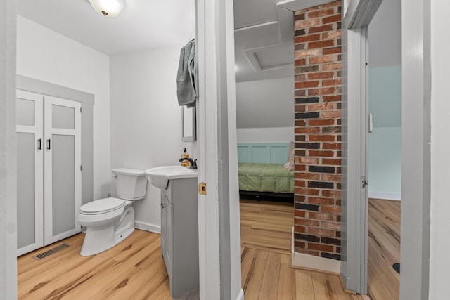 23 Cottage Dr, Friendship, ME 04547 - bathroom featuring vanity, wood finished floors, and connected bathroom