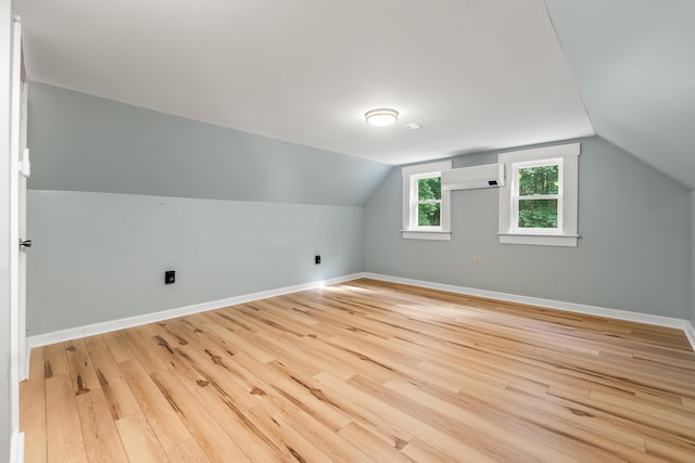 23 Cottage Dr, Friendship, ME 04547 - bonus room featuring an AC wall unit, light wood finished floors, and vaulted ceiling