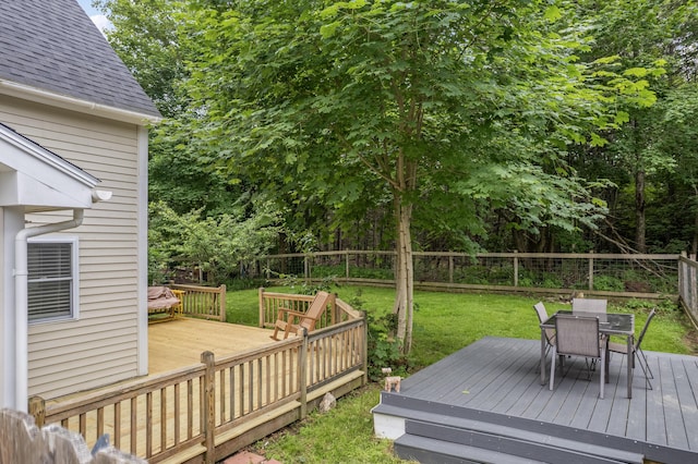 23 Cottage Dr, Friendship, ME 04547 - wooden deck with a fenced backyard and outdoor dining area