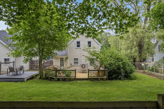 23 Cottage Dr, Friendship, ME 04547 - rear view of property featuring a fenced backyard, a wooden deck, and roof with shingles