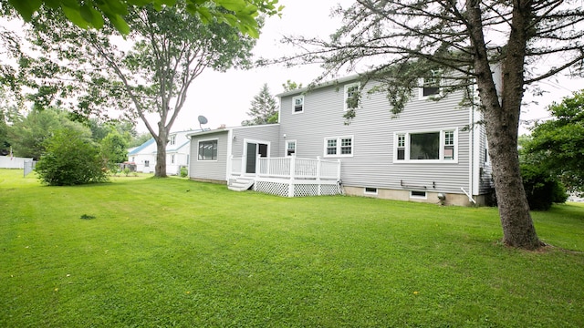 48 Clover Ln, Brewer, ME 04412 - back of house featuring a lawn and a wooden deck