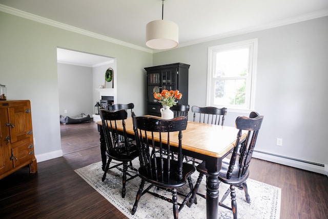 48 Clover Ln, Brewer, ME 04412 - dining area with ornamental molding, a baseboard heating unit, dark wood-style floors, and a fireplace