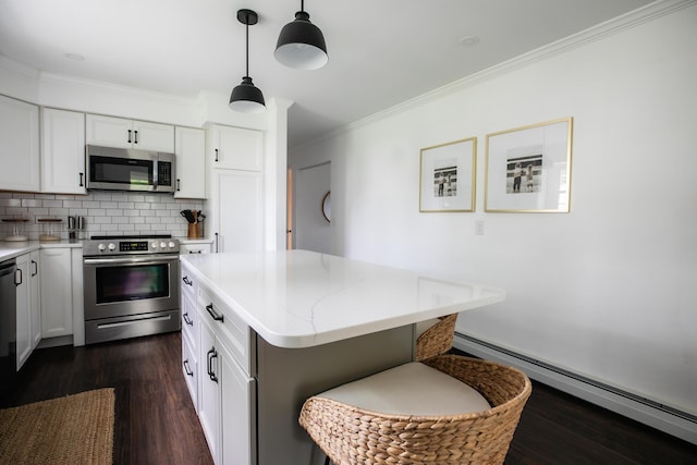 48 Clover Ln, Brewer, ME 04412 - kitchen with stainless steel appliances, baseboard heating, crown molding, dark wood-type flooring, and backsplash