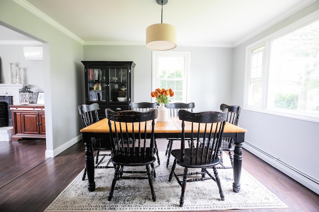 48 Clover Ln, Brewer, ME 04412 - dining area with baseboard heating, dark wood-style floors, and crown molding