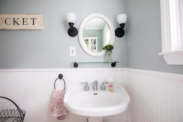 48 Clover Ln, Brewer, ME 04412 - bathroom featuring a sink and wainscoting