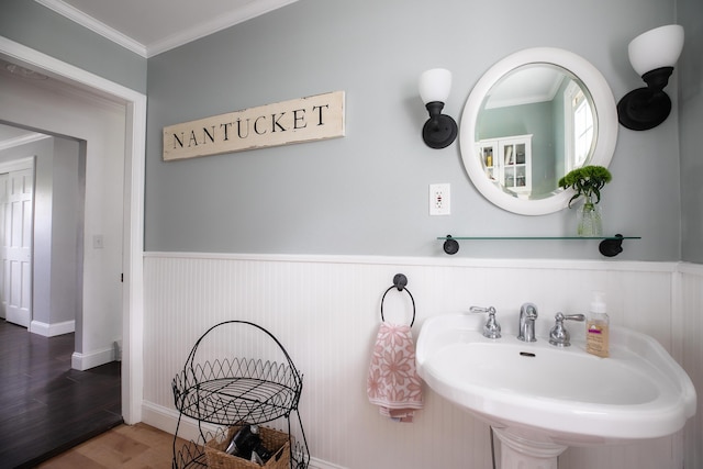 48 Clover Ln, Brewer, ME 04412 - bathroom with wainscoting, wood finished floors, and ornamental molding