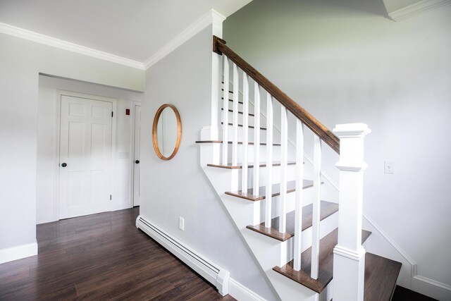 48 Clover Ln, Brewer, ME 04412 - stairway with a baseboard heating unit, wood finished floors, and ornamental molding