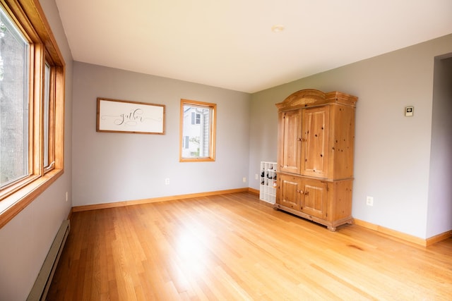 48 Clover Ln, Brewer, ME 04412 - spare room featuring baseboard heating, plenty of natural light, and light wood finished floors
