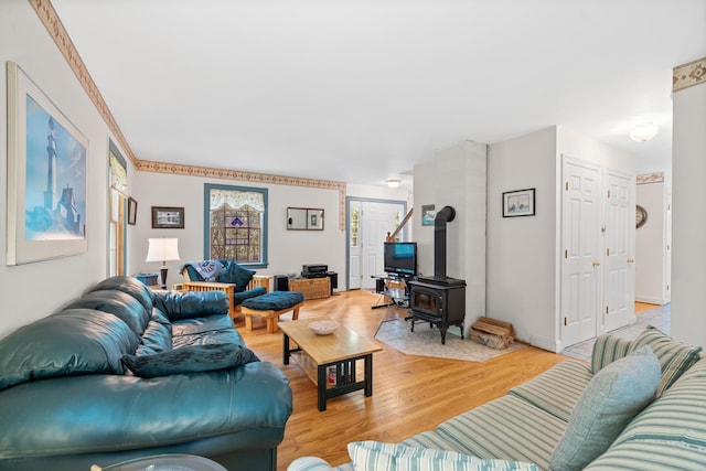 17 Summit St, Ogunquit, ME 03907 - living area with a wood stove and light wood-style flooring