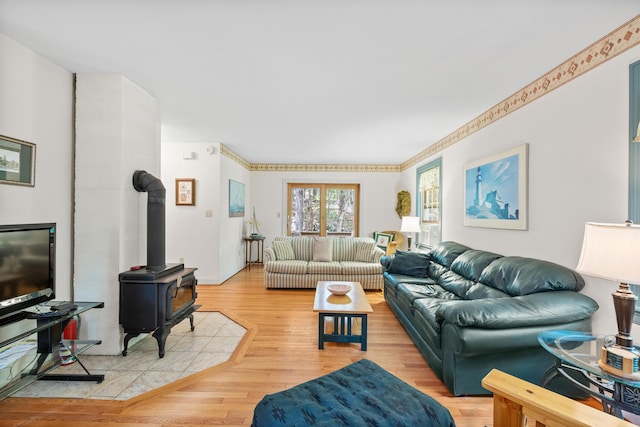 17 Summit St, Ogunquit, ME 03907 - living room featuring a wood stove and light wood finished floors