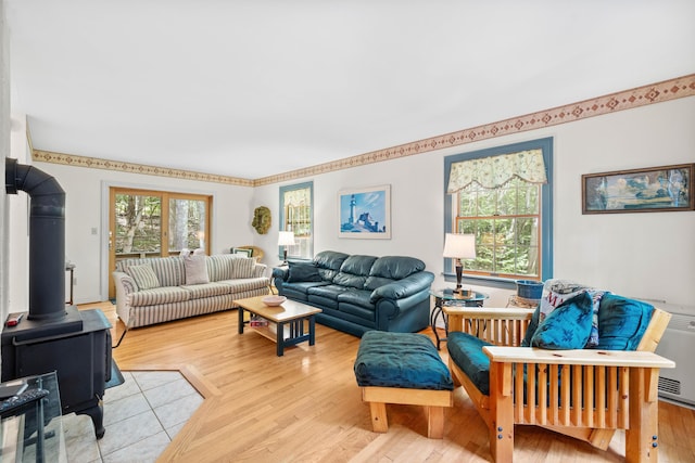 17 Summit St, Ogunquit, ME 03907 - living area with a wood stove and light wood-style floors
