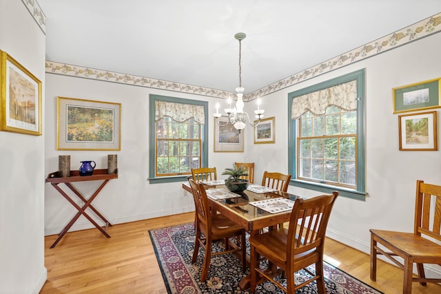 17 Summit St, Ogunquit, ME 03907 - dining room with a chandelier, light wood-style floors, and healthy amount of natural light