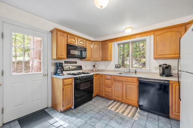 17 Summit St, Ogunquit, ME 03907 - kitchen with black appliances, light countertops, and light tile patterned floors