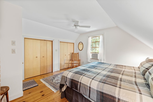 17 Summit St, Ogunquit, ME 03907 - bedroom featuring light wood-style floors, vaulted ceiling, two closets, cooling unit, and ceiling fan