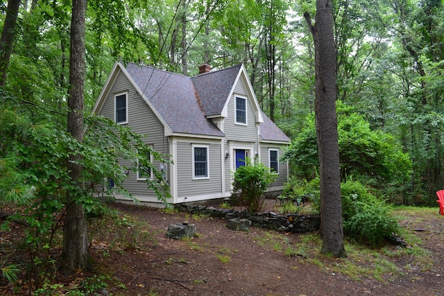 17 Summit St, Ogunquit, ME 03907 - view of front of house with a shingled roof and a chimney