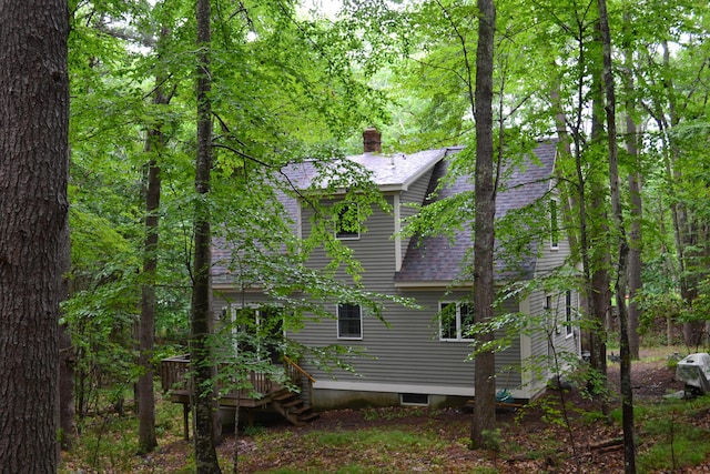 17 Summit St, Ogunquit, ME 03907 - view of side of home with a shingled roof, a chimney, and a wooden deck