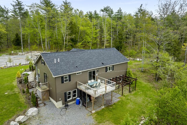 85 Lions Ridge Rd, Alna, ME 04535 - rear view of property featuring a deck, roof with shingles, stairs, and a forest view