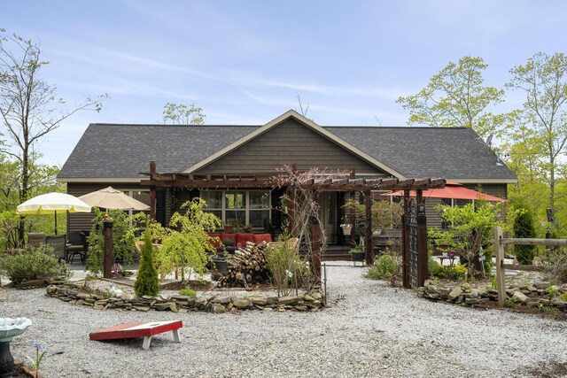 85 Lions Ridge Rd, Alna, ME 04535 - view of front of house featuring a pergola, a shingled roof, and a patio